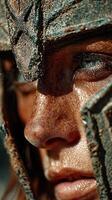 Close-up of a warrior's face with battle armor during a reenactment at sunset, highlighting intense expression and intricate details of the helmet photo
