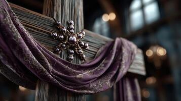 Intricate wooden cross adorned with fabric draping in an atmospheric, dimly lit interior setting with decorative elements photo