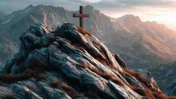 Mountain landscape with wooden cross at sunset overlooking rugged peaks and valleys photo