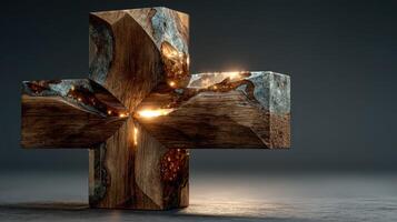 Unique wooden and metal cross sculpture glowing beautifully in a dark space photo