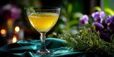 Freshly prepared cocktail served in an elegant glass, surrounded by vibrant flowers and soft candlelight photo