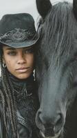 Portrait of a woman in black attire with a horse exuding strength and connection in a natural setting photo