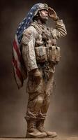Soldier in military gear saluting while draped in American flag against a neutral background photo