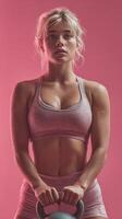 Fitness enthusiast training with kettlebell in pink studio, showcasing strength and dedication during workout session photo