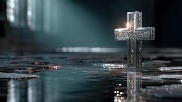 Reflective cross illuminated in a serene setting within a dimly lit sacred space photo