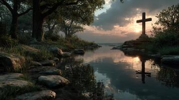 Sunset reflection over a serene river with a stone cross in a tranquil natural setting photo