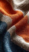 Textured fabric showcases vibrant colors and intricate weaving techniques in close-up view photo