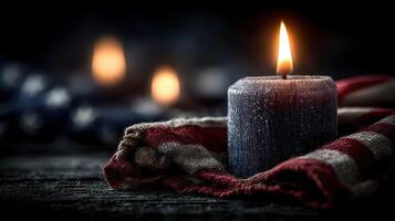 Candle flickering softly on fabric with a vintage flag pattern, showcasing a warm ambiance in dim lighting photo