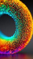 Colorful abstract design featuring a vibrant dotted spiral shape against a dark background photo