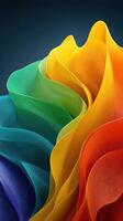 Colorful waves of fabric create a vibrant abstract texture in a studio setting photo