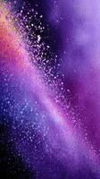 Colorful burst of swirling particles creates vibrant abstract art in purple and pink shades photo