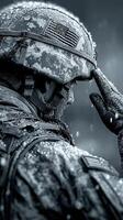 Soldier saluting under rain with determination and honor during military exercise in a remote training area photo