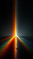 Vibrant light beams create stunning rainbow reflections on dark water surface at twilight photo
