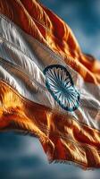 Indian flag waving proudly against a clear blue sky on a sunny day showcasing national pride and identity photo