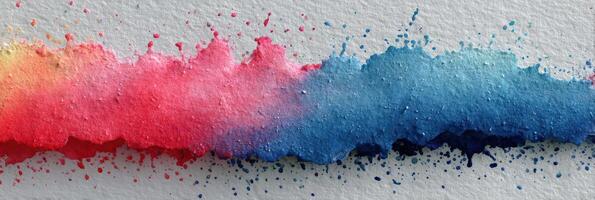 Vibrant watercolor splash blending shades of pink, blue, and purple on textured paper background photo