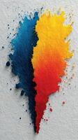 Splashes of blue, gold, and red blend artistically on textured paper creating a vibrant abstract piece in the afternoon light photo