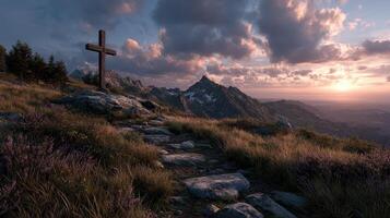Sunset view of a rocky pathway leading to a cross on a mountain in the wilderness photo