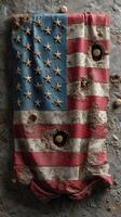 Weathered American flag displayed on a textured surface with bullet holes reflecting a history of resilience and struggle photo