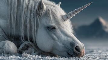 Majestic white unicorn resting peacefully in a snowy landscape during twilight hours photo