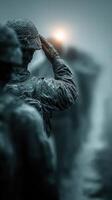 Soldiers in formation salute during a rainy dawn at a military base, demonstrating discipline and camaraderie photo