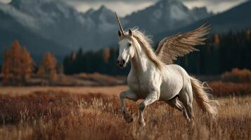 Majestic winged unicorn running through a golden meadow with mountains in the background photo