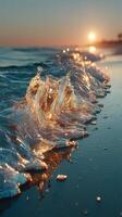 Waves crashing gently on the shore during sunset creates a serene coastal atmosphere photo