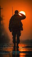 Soldier saluting at sunset in a tranquil landscape symbolizing honor and sacrifice photo