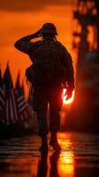 Soldier saluting at sunset with American flags in the background during a military ceremony near a naval ship photo