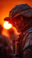Soldier saluting at sunset in a frost-covered landscape during training exercise photo