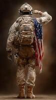 Soldier saluting with American flag draped over shoulder, reflecting duty and honor in military setting photo