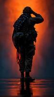 Silhouette of soldier saluting against vibrant background during twilight photo
