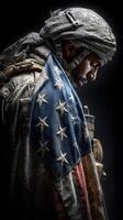 Soldier draped in American flag stands solemnly in a darkened environment photo