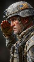 Soldier saluting with honor while wearing a tactical uniform and American flag patch in a dusty environment photo