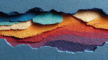 Colorful layers of paint reveal artistic texture on a blue wall surface in an urban environment showing creativity in design photo