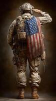Soldier in tactical uniform saluting with American flag draped on back during dusk in a rugged setting photo
