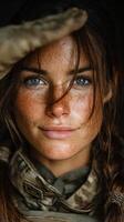 Close-up of a soldier saluting with determination in a military setting during daylight hours photo
