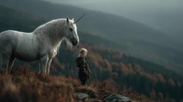 Child stands in awe before a majestic unicorn on a misty mountainside during early morning light photo