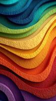 Colorful layers of textured paper arranged in wavy patterns showcasing a vibrant spectrum from blue to purple during daylight photo