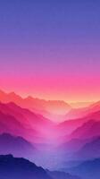 Vibrant sunrise hues illuminate the misty mountain landscape at dawn photo