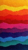 Bright layers of colored paper create a vibrant abstract landscape with waves of various hues in a gradient style photo