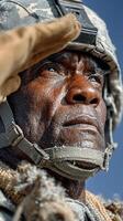 Soldier salutes with determination in cold conditions at military training exercise in winter photo