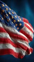 Historic American flag waving against a blue background during a patriotic celebration in the United States on a sunny day photo