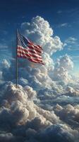 American flag waving proudly above a sea of fluffy clouds during a bright day photo