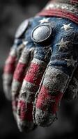 Weathered work glove adorned with American flag design captures the spirit of hard work and patriotism photo