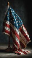 Historic American flag displayed against a dark background in a quiet setting capturing a sense of patriotism and history photo