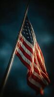 American flag waving against a dark sky during twilight hours emphasizing patriotism and freedom photo