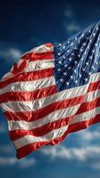 American flag waving in the breeze against a clear blue sky on a sunny day photo