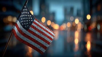 Rain-drenched American flag waving in the city at twilight, creating a patriotic urban backdrop photo