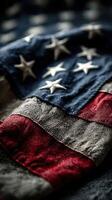 American flag draped across a surface showcasing its historical colors and patterns with stars and stripes prominently displayed photo
