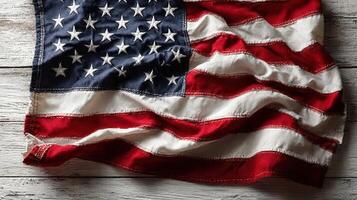 American flag displayed on a rustic wooden surface symbolizes patriotism and national pride during a festive celebration photo